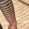 What does a tattoo in the form of two stripes mean? What does a stripe tattoo on the leg mean?